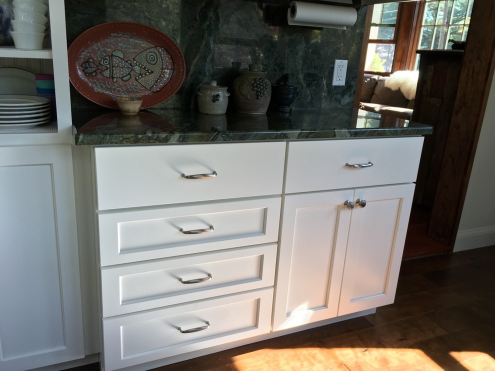 Example of a transitional u-shaped dark wood floor kitchen design in Boston with an undermount sink, shaker cabinets, white cabinets, granite countertops and stainless steel appliances