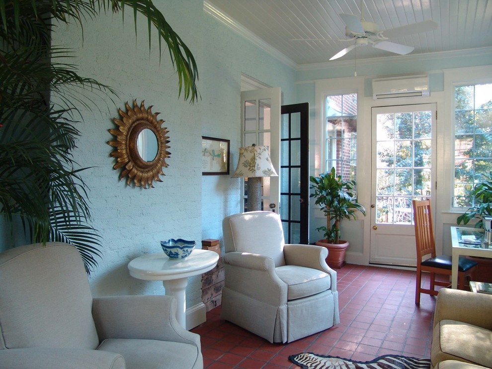 Photo of a traditional sunroom in Atlanta with terra-cotta floors, a standard ceiling and red floor.