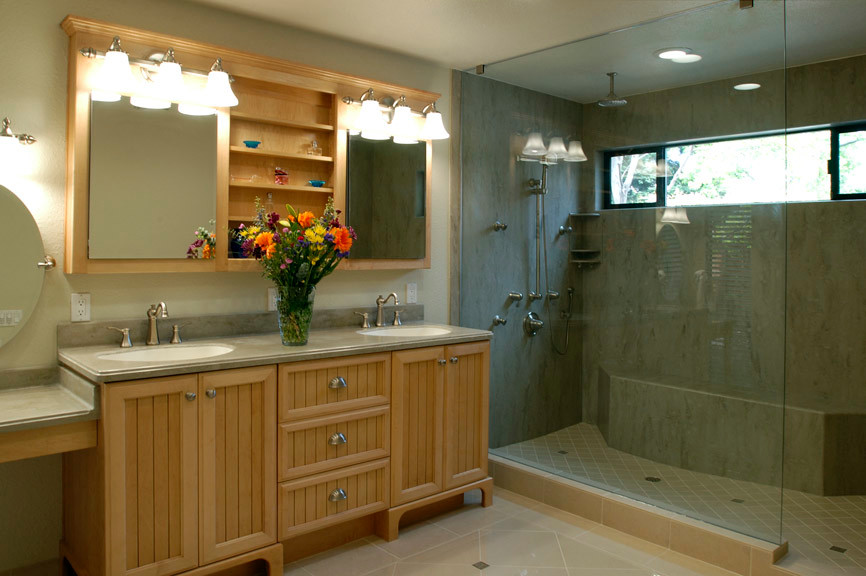 Photo of an expansive traditional bathroom in Sacramento with an integrated sink, beaded inset cabinets, medium wood cabinets, solid surface benchtops, beige tile, porcelain tile, beige walls, porcelain floors and with a sauna.