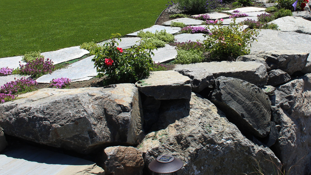 Design ideas for a large transitional partial sun backyard stone formal garden in Seattle for summer.