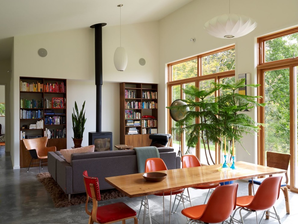 This is an example of a modern living room in New York with a library.