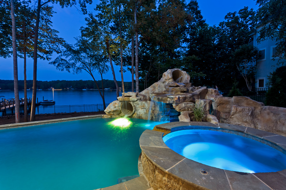 Water slide - large rustic indoor stone and custom-shaped indoor water slide idea in Charlotte