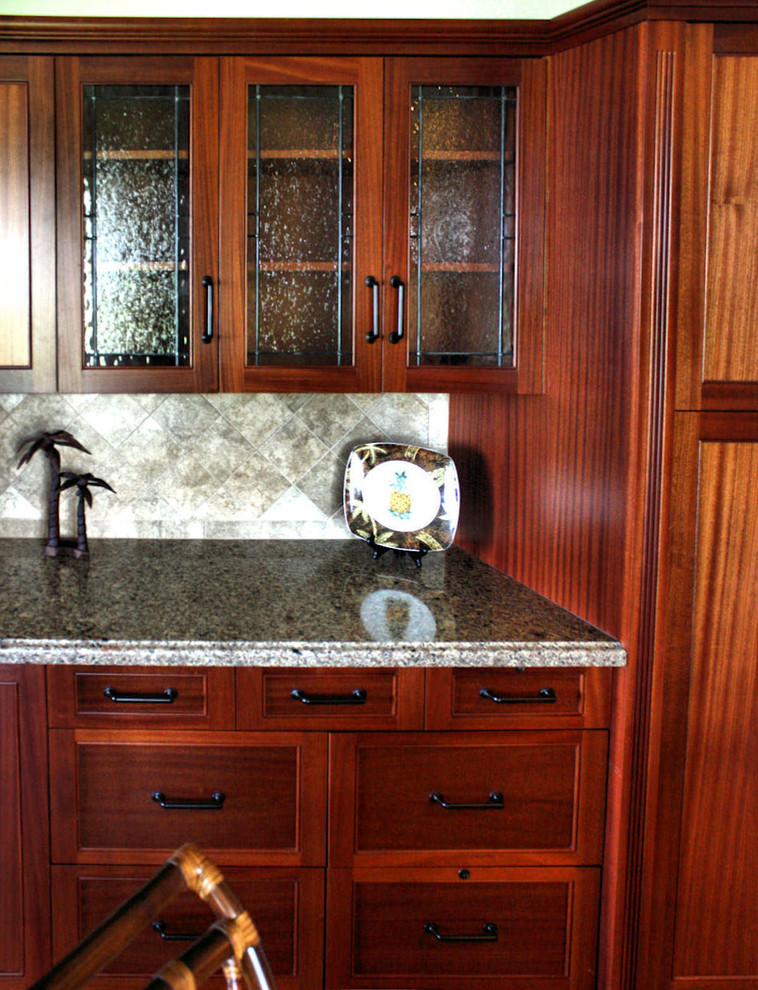 Inspiration for a traditional kitchen in Hawaii with glass-front cabinets.