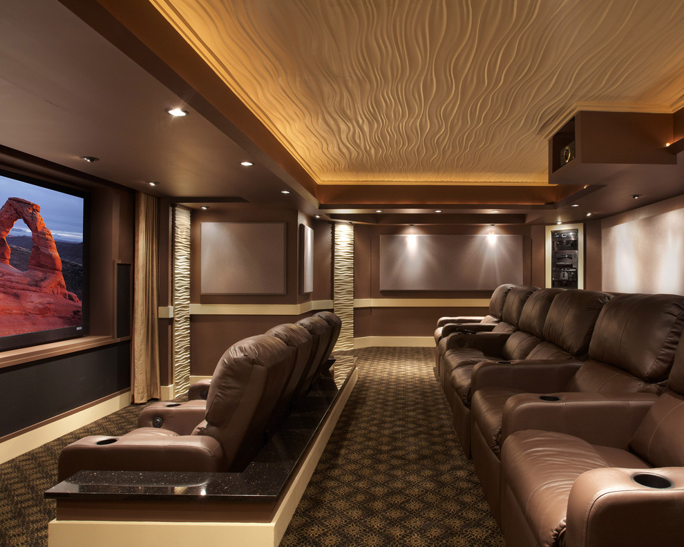 Photo of a contemporary home theatre in DC Metro with brown walls and a projector screen.