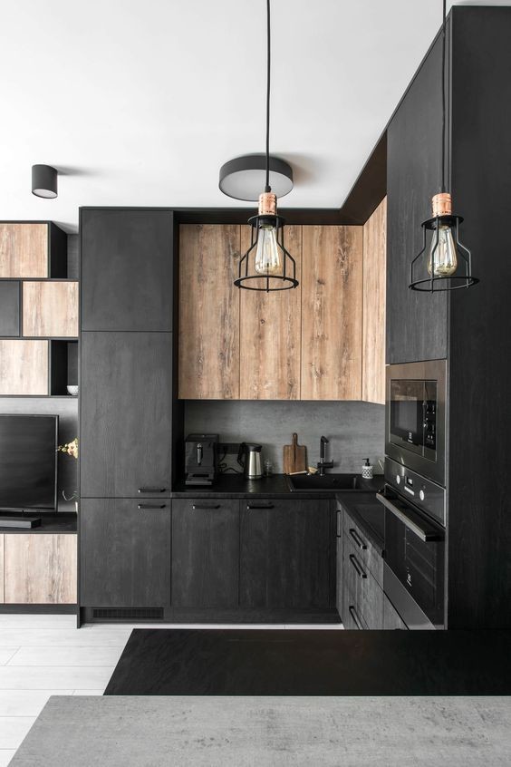 Large modern grey and black l-shaped open plan kitchen in Austin with a double-bowl sink, flat-panel cabinets, concrete worktops, black splashback, cement tile splashback, integrated appliances, light hardwood flooring, an island, brown floors, black worktops and all types of ceiling.