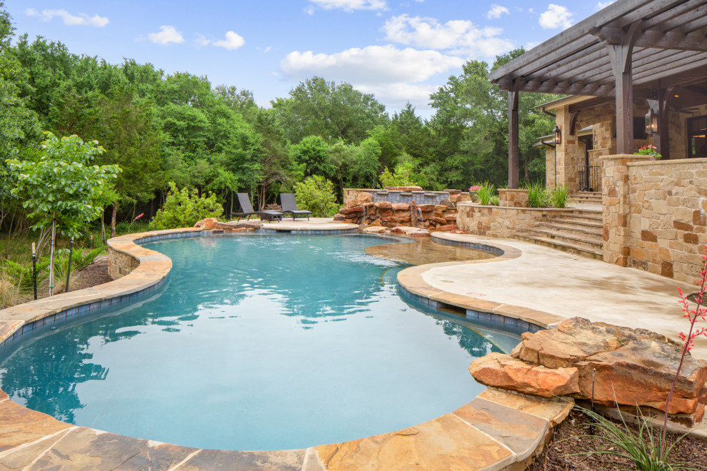 Example of a mountain style custom-shaped pool fountain design