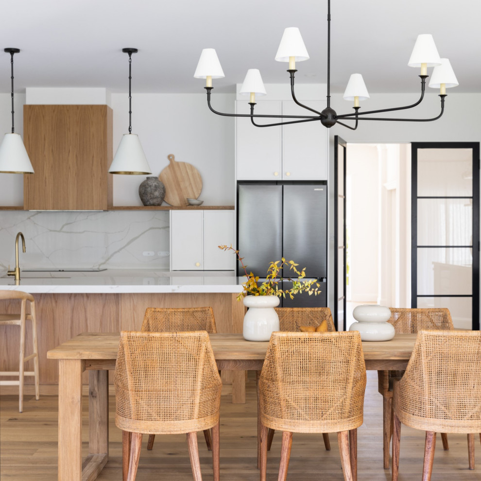 This is an example of a contemporary dining room in Sydney.
