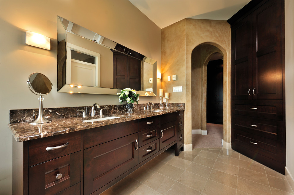 This is an example of a traditional bathroom in Vancouver with granite benchtops and brown benchtops.