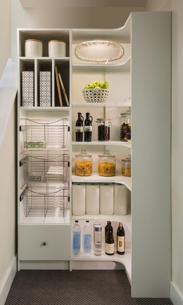Photo of a small transitional l-shaped kitchen pantry in Philadelphia with white cabinets and open cabinets.