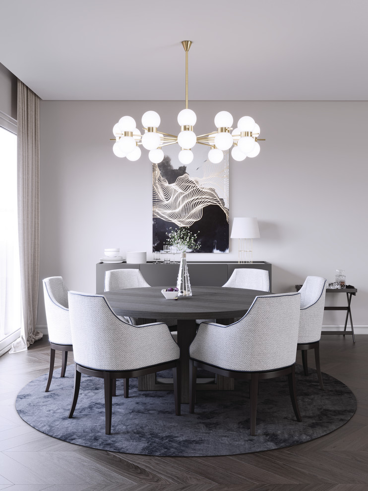 Photo of a contemporary dining room in London with grey walls, dark hardwood floors and brown floor.