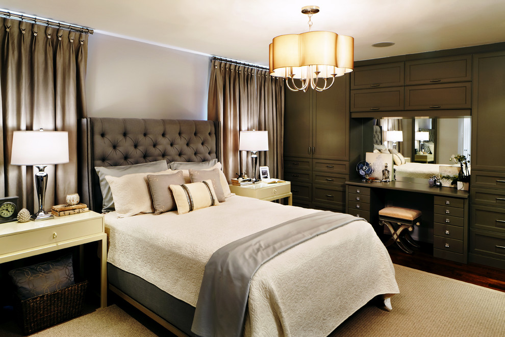 This is an example of a traditional master bedroom in Toronto with grey walls, dark hardwood floors and no fireplace.