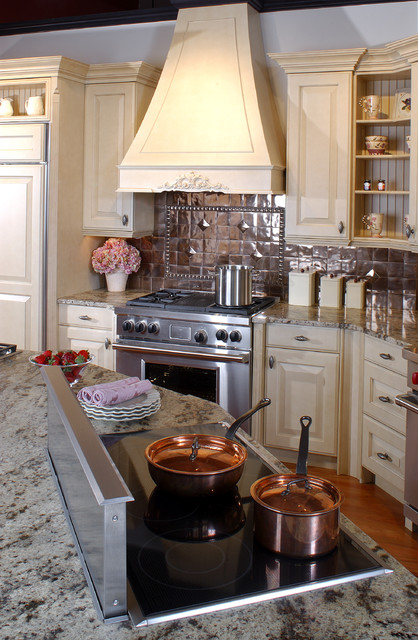 Latte Cabinets With A Copper Backsplash Traditional Kitchen