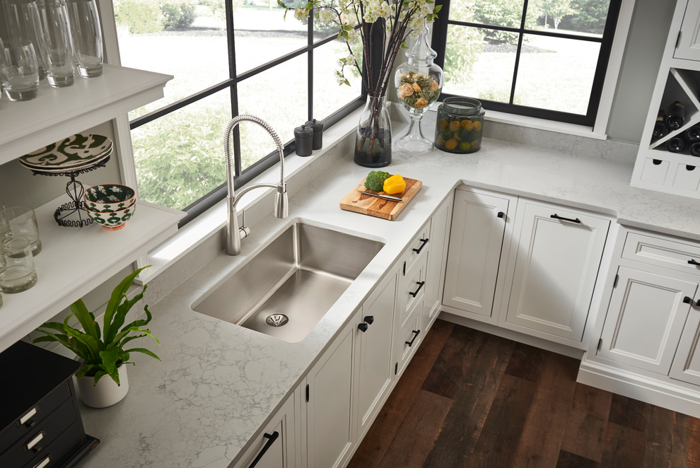 Photo of a transitional kitchen in Chicago with an undermount sink, white cabinets and white benchtop.