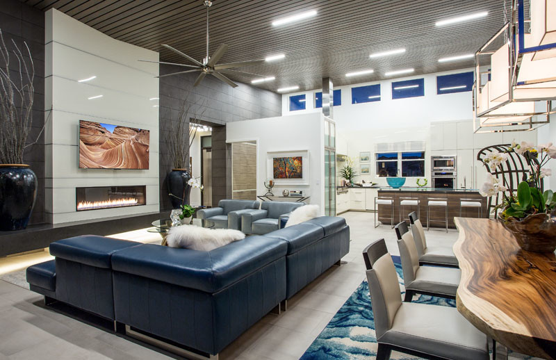 Large midcentury open concept family room in Salt Lake City with white walls, ceramic floors, a ribbon fireplace, a metal fireplace surround and a wall-mounted tv.