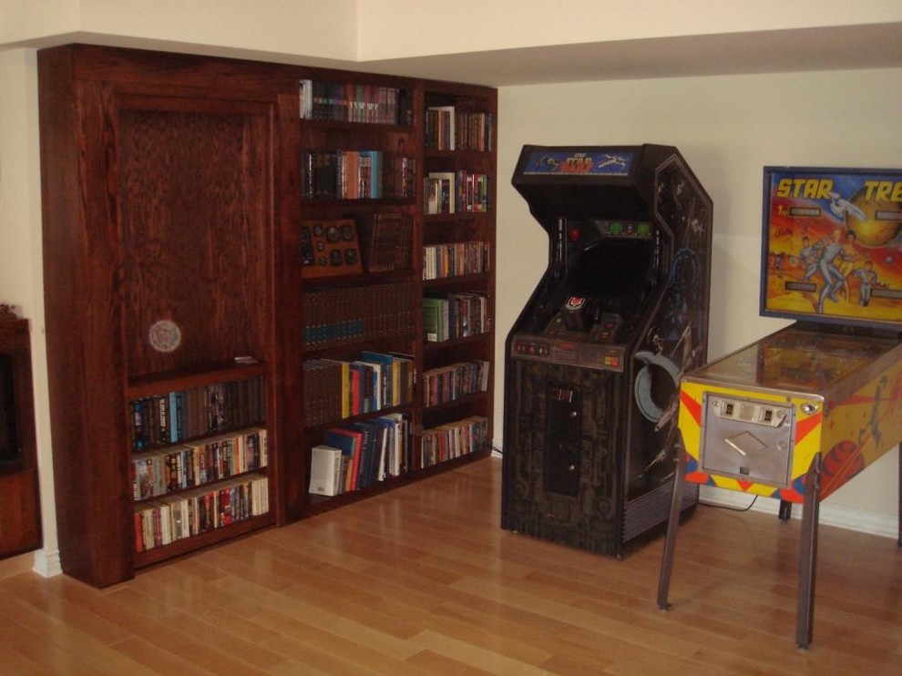 This is an example of a family room in Milwaukee with a game room and no fireplace.