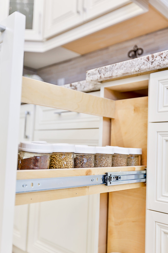 Example of a transitional kitchen design in Toronto
