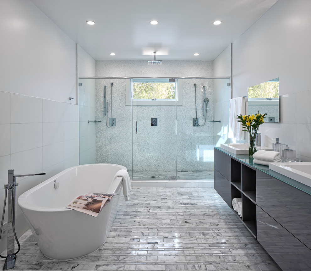 Photo of a contemporary bathroom in New York with a hinged shower door.