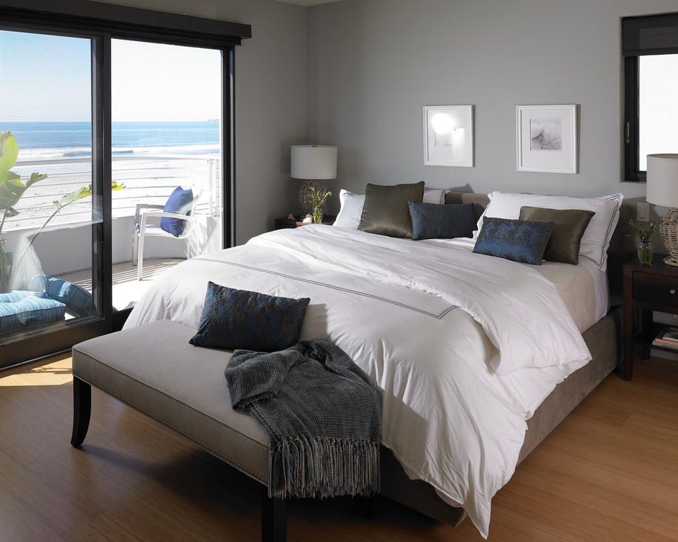 Inspiration for a large beach style master bedroom in San Francisco with grey walls, light hardwood floors and beige floor.