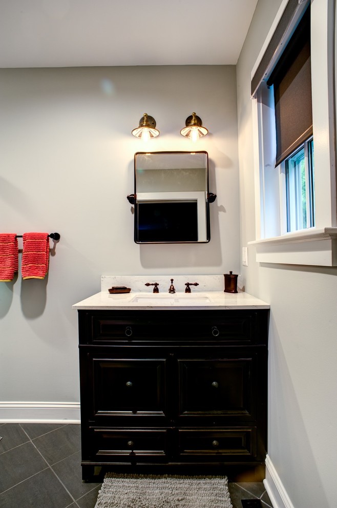 Inspiration for a mid-sized transitional master slate floor and gray floor bathroom remodel with recessed-panel cabinets, dark wood cabinets, gray walls, an undermount sink and quartz countertops