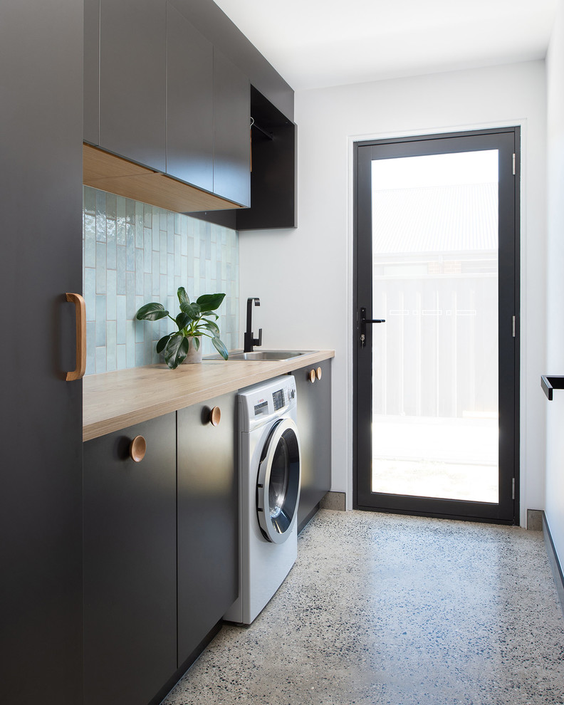 This is an example of a scandinavian laundry room in Hobart.