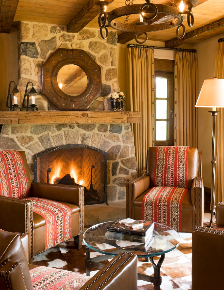 This is an example of a country enclosed living room in San Francisco with a standard fireplace and a stone fireplace surround.