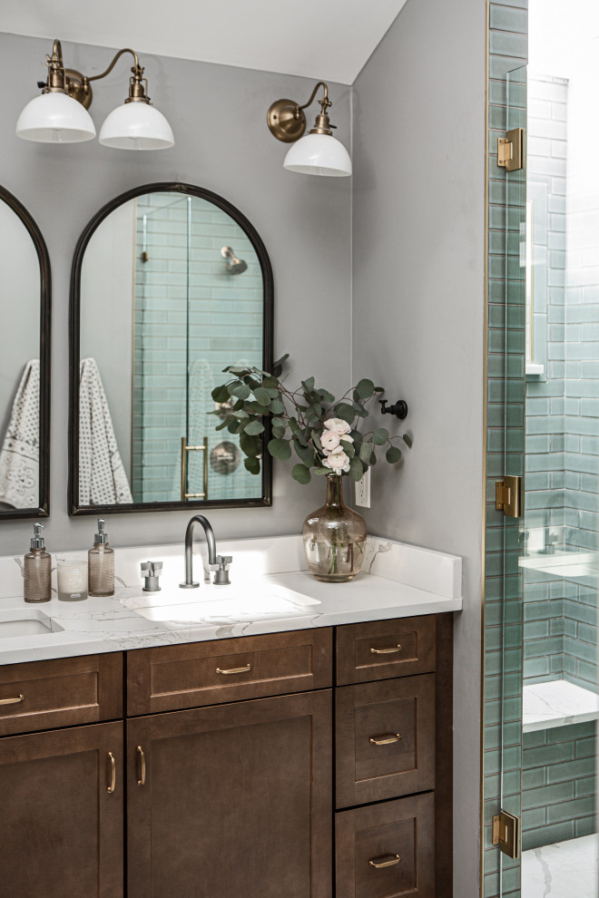 Inspiration for a mid-sized transitional master bathroom in Denver with shaker cabinets, dark wood cabinets, an alcove shower, green tile, ceramic tile, grey walls, porcelain floors, an undermount sink, engineered quartz benchtops, white floor, a hinged shower door, white benchtops, a double vanity, a shower seat and a built-in vanity.