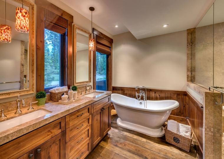 Design ideas for a large traditional master bathroom in Sacramento with medium wood cabinets, marble benchtops, a freestanding tub, beige walls, medium hardwood floors and an undermount sink.
