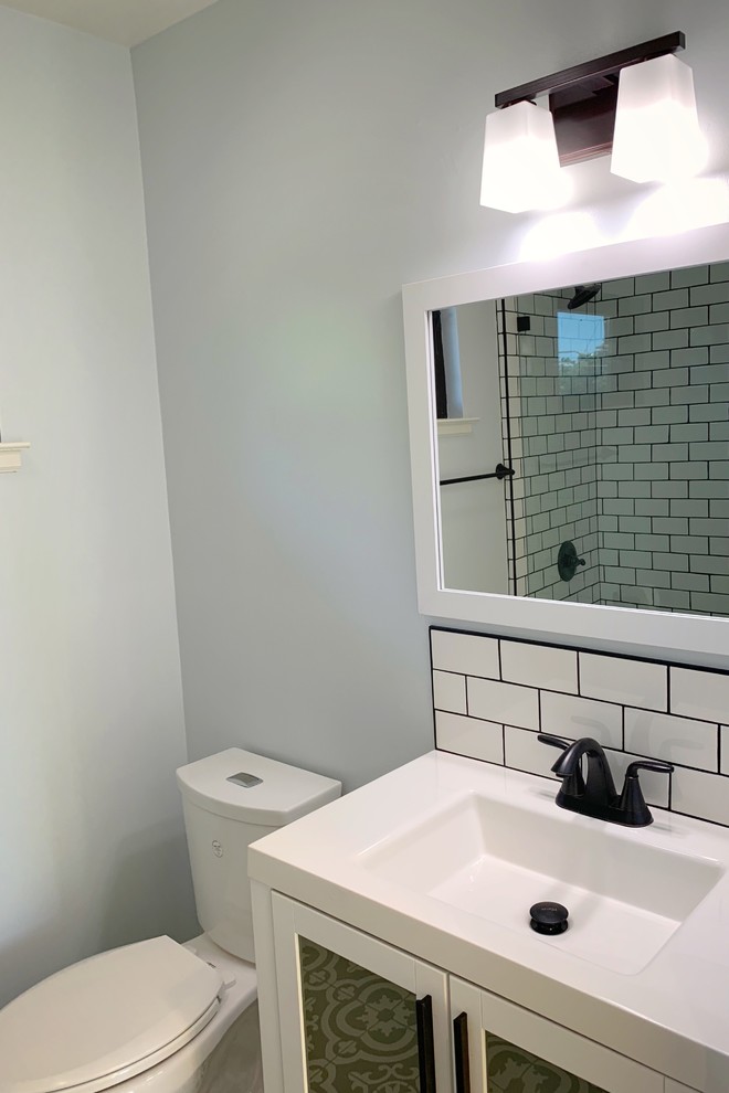 Design ideas for a small transitional 3/4 bathroom in San Francisco with flat-panel cabinets, white cabinets, an alcove shower, white tile, subway tile, slate floors, an integrated sink, solid surface benchtops, an open shower and white benchtops.