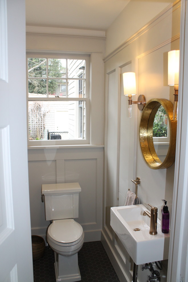 Small transitional powder room in Seattle with gray tile and ceramic floors.
