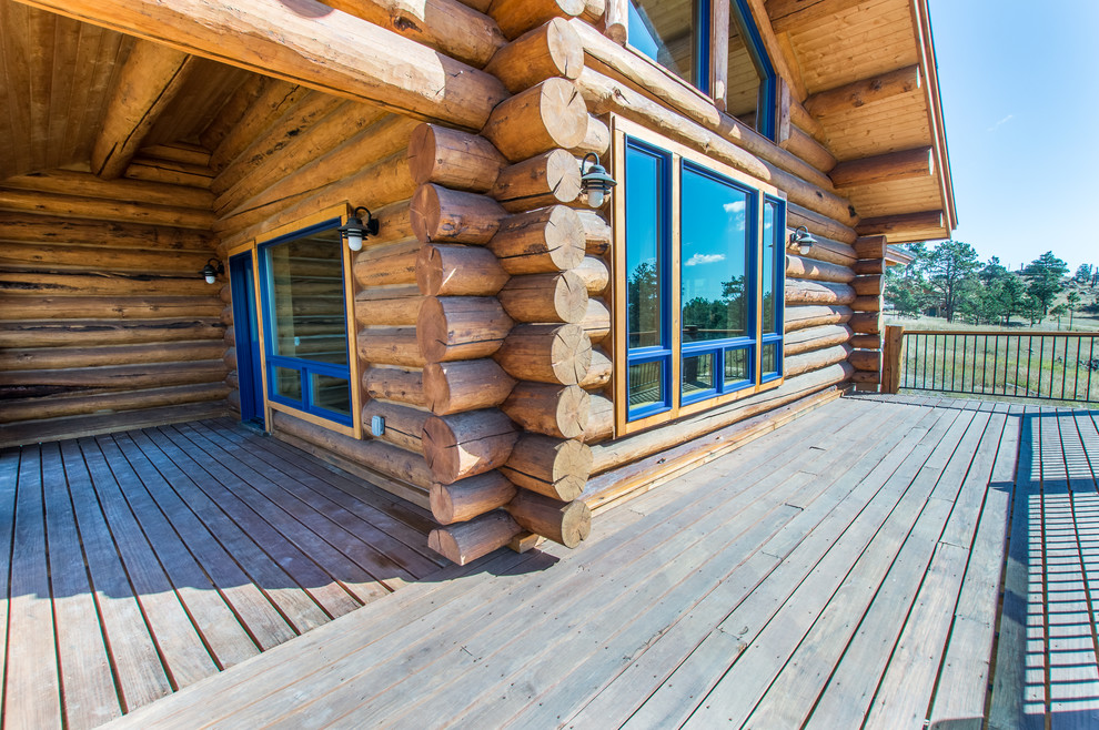 Inspiration for a mid-sized rustic backyard deck remodel in Denver with no cover