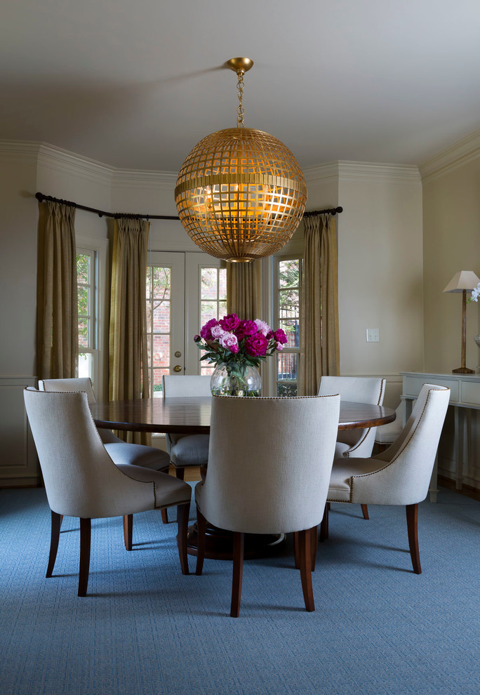 Photo of a large traditional dining room in Charlotte with white walls and carpet.
