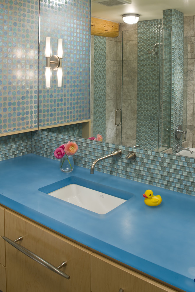 Contemporary kids bathroom in Other with mosaic tile and blue benchtops.