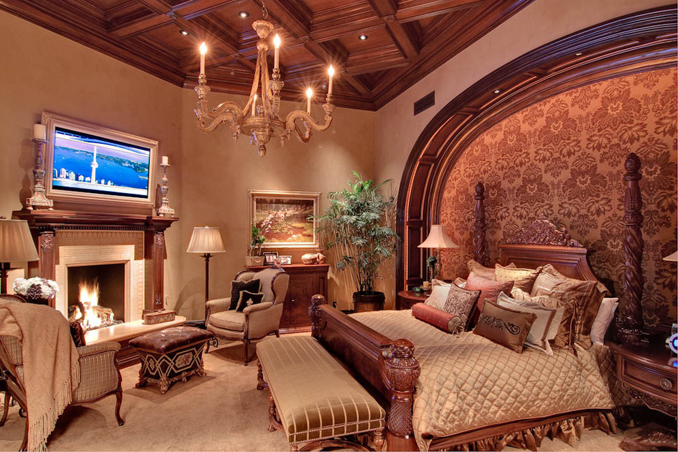 Traditional master bedroom in Phoenix with beige walls, carpet, a tile fireplace surround and a corner fireplace.
