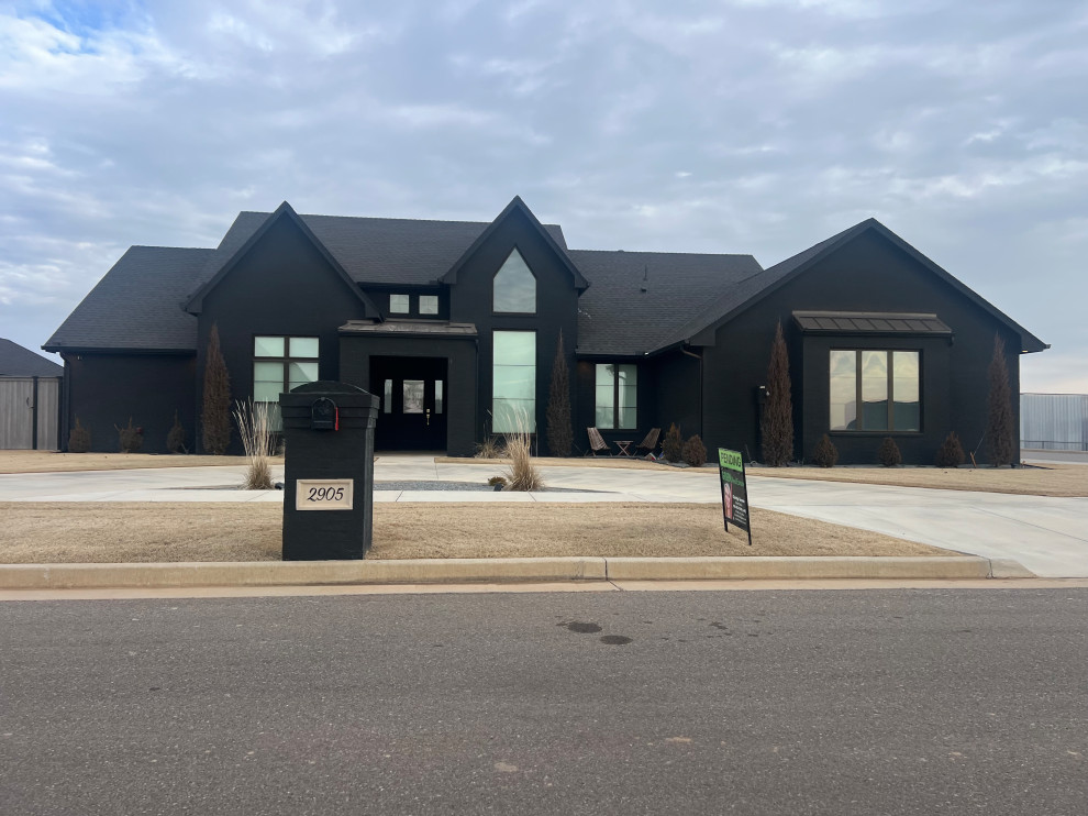 Modern home with dark painted brick