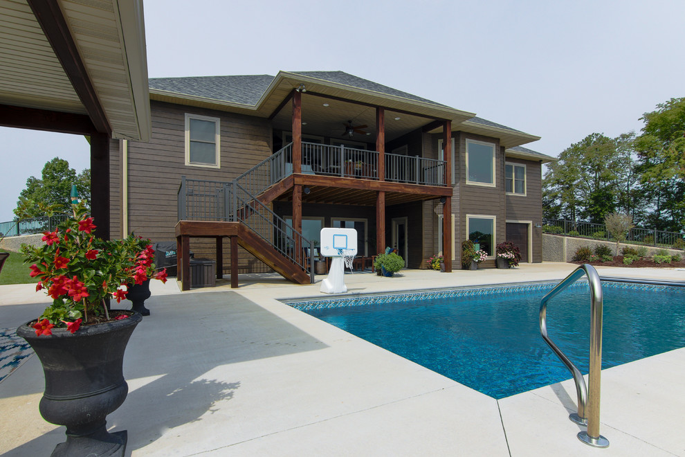 Large mountain style backyard concrete and rectangular pool photo