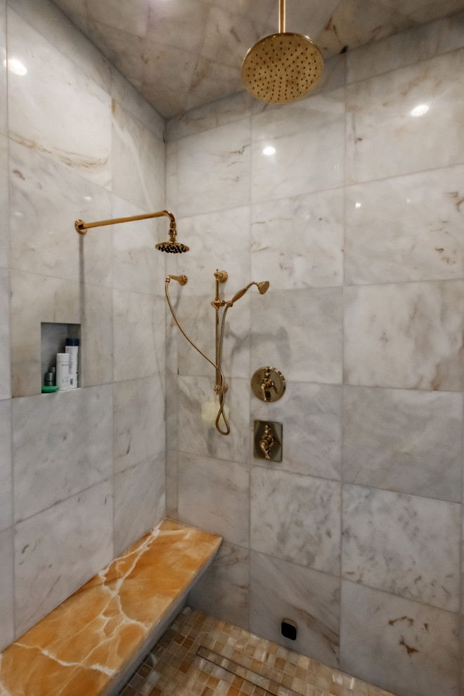 Cette photo montre une grande salle de bain principale victorienne en bois foncé avec un placard avec porte à panneau surélevé, une baignoire sur pieds, une douche d'angle, un carrelage gris, du carrelage en marbre, un mur marron, un sol en marbre, un lavabo encastré, un plan de toilette en onyx, un sol gris, une cabine de douche à porte battante, un plan de toilette orange, un banc de douche et meuble-lavabo encastré.