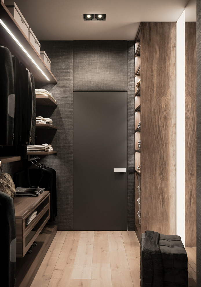 Inspiration for a mid-sized scandinavian gender-neutral walk-in wardrobe in Valencia with flat-panel cabinets, medium wood cabinets, light hardwood floors and beige floor.