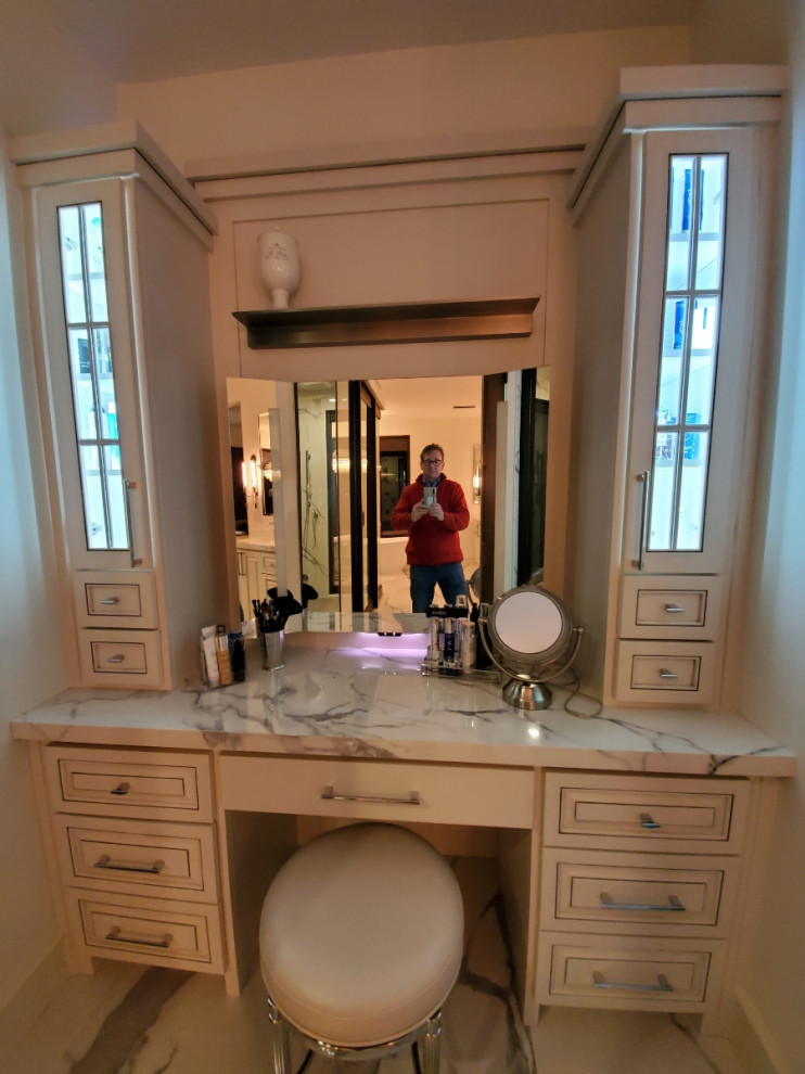 Photo of a large contemporary ensuite bathroom in Other with raised-panel cabinets, white cabinets, a freestanding bath, a double shower, porcelain tiles, porcelain flooring, a submerged sink, a hinged door, double sinks and a built in vanity unit.
