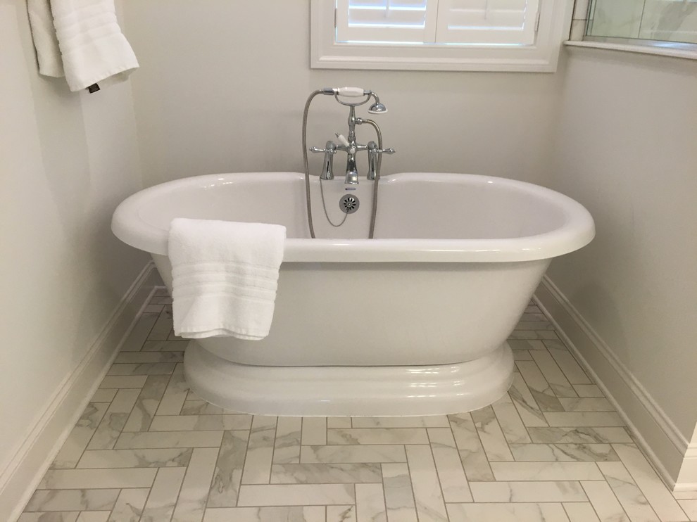 Design ideas for a large transitional master bathroom in Other with shaker cabinets, white cabinets, a freestanding tub, an alcove shower, a one-piece toilet, white tile, porcelain tile, white walls, porcelain floors, an undermount sink, engineered quartz benchtops, white floor, a hinged shower door and white benchtops.
