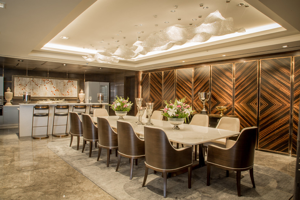 This is an example of a Large contemporary open plan dining in Bengaluru With Marble Floors.
