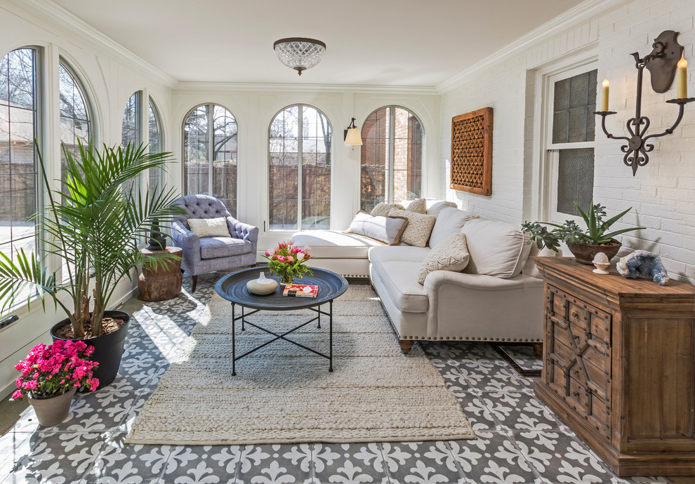 This is an example of a mid-sized traditional sunroom in Milwaukee with no fireplace, a standard ceiling, multi-coloured floor and ceramic floors.