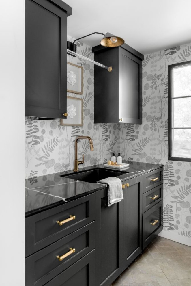 Inspiration for a mid-sized country u-shaped dedicated laundry room in Los Angeles with an undermount sink, shaker cabinets, black cabinets, marble benchtops, multi-coloured splashback, ceramic floors, a side-by-side washer and dryer and black benchtop.