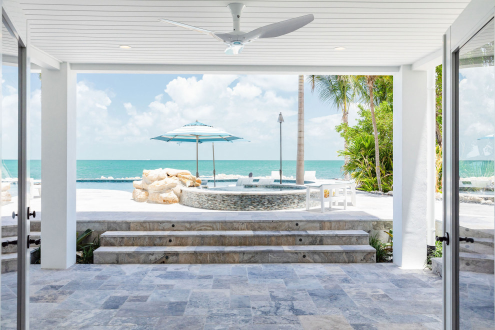 This is an example of a beach style home design in Miami.