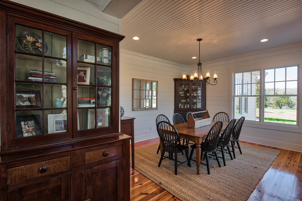 Mid-sized country open plan dining in Other with white walls, medium hardwood floors and no fireplace.
