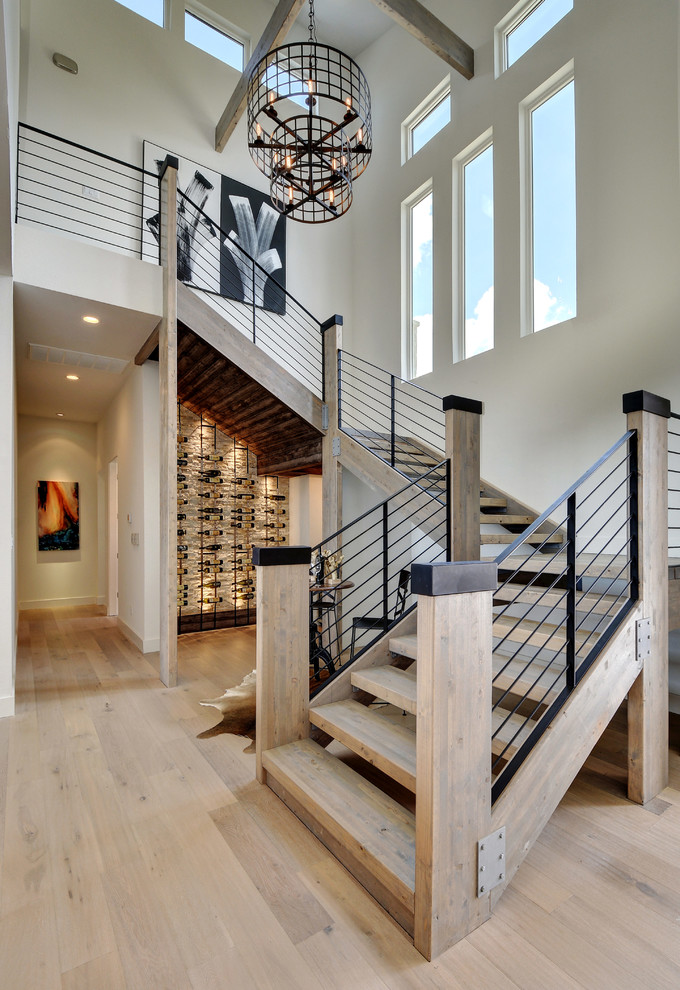 Large contemporary wood staircase in Austin with open risers.