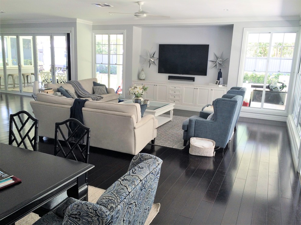 This is an example of a large traditional formal open concept living room in Brisbane with a wall-mounted tv.