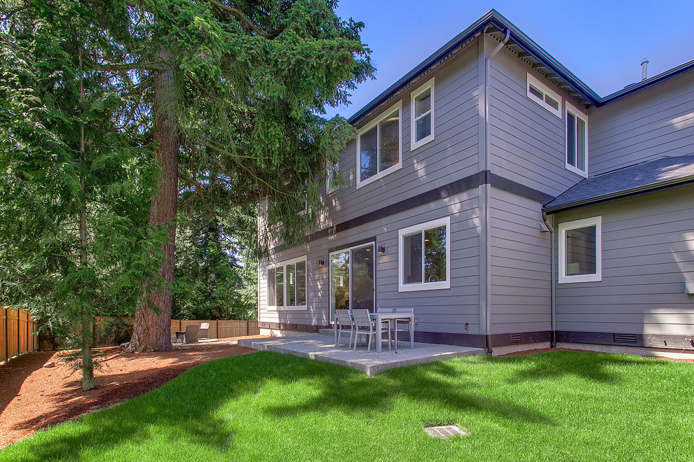 This is an example of a large transitional two-storey grey exterior in Seattle with mixed siding.