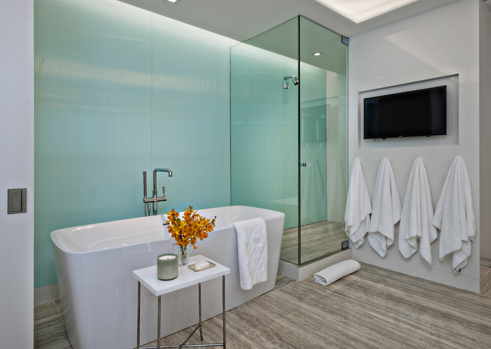 Example of a mid-sized minimalist master blue tile gray floor freestanding bathtub design in Miami with white walls, a hinged shower door, flat-panel cabinets, white cabinets, an undermount sink, quartz countertops and white countertops