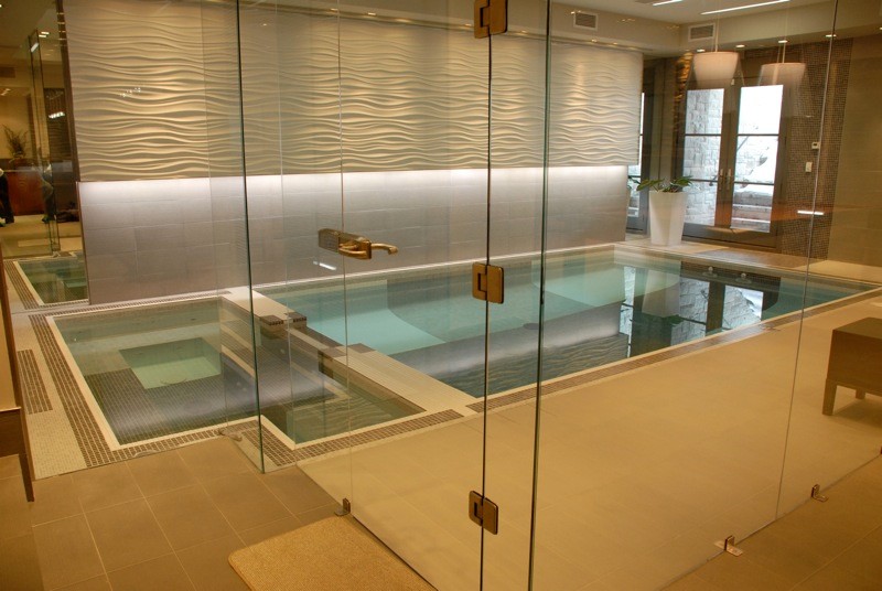 Example of a mid-sized mountain style tile and rectangular indoor pool design
