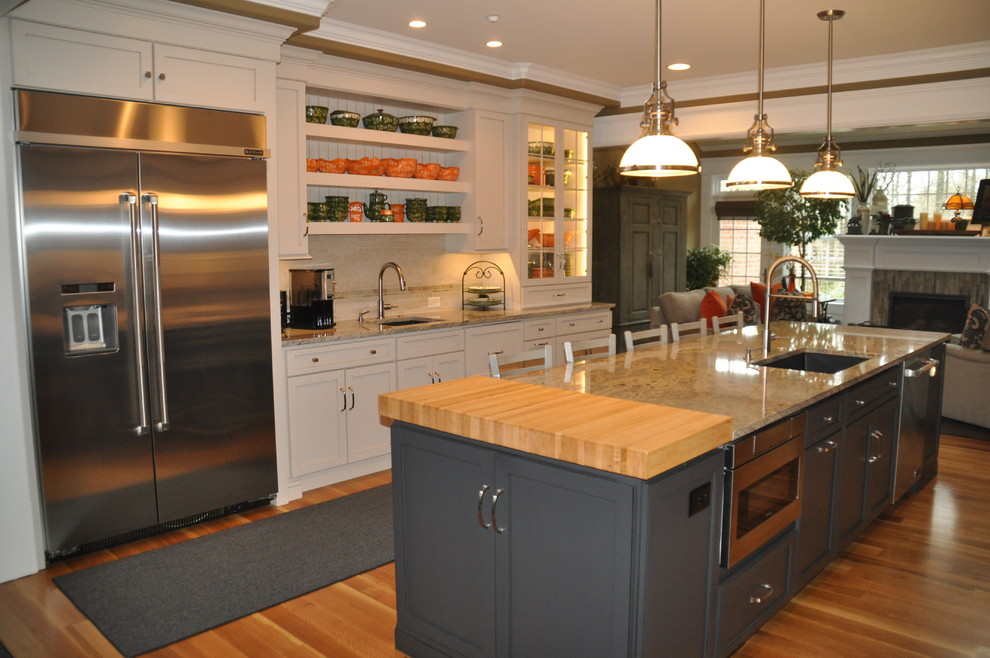 Example of a large transitional light wood floor eat-in kitchen design in Baltimore with an undermount sink, flat-panel cabinets, gray cabinets, granite countertops, gray backsplash, stainless steel appliances, an island and multicolored countertops